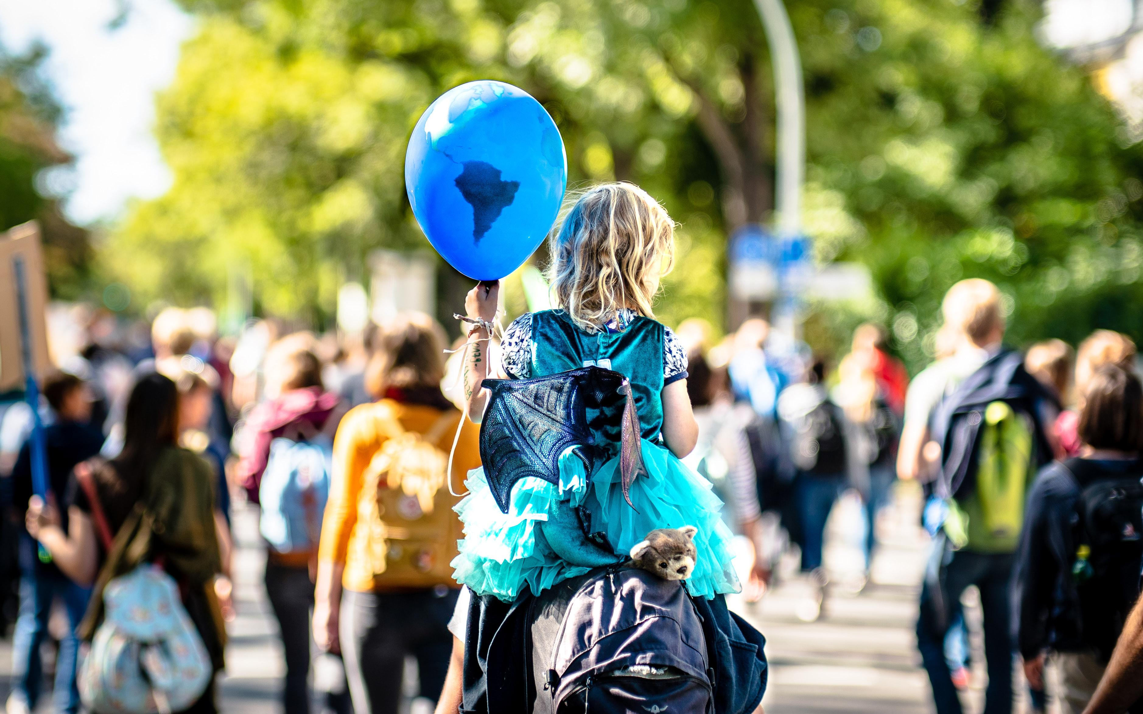 child holding balloon